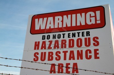 8025382-toxic-waste-site-warning-of-cancer-behind-barbed-wire